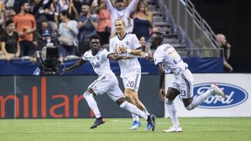 Vancouver Whitecaps&#039; Alphonso Davies, Brek Shea and Kei Kamara, from left, celebrate Davies&#039; second goal against Minnesota United during the second half of an MLS soccer match Saturday, July 28, 2018, in Vancouver, British Columbia. (Darryl Dyck/The Canadian Press via AP)