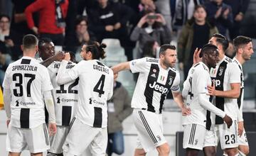 Juventus' Italian forward Moise Kean (2ndL) celebrates opening the scoring with teammates during the Italian Serie A football match Juventus vs Udinese on March 8, 2019 at the Juventus Allianz stadium in Turin.