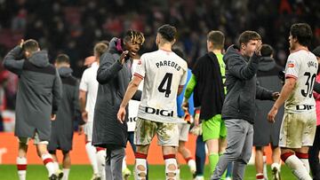 Athletic Bilbao's Spanish forward #11 Nico Williams (L) and Athletic Bilbao's Spanish defender #04 Aitor Paredes celebrate their victory at the end of the Spanish Copa del Rey (King's Cup) semi final first leg football match between Club Atletico de Madrid and Athletic Club Bilbao at the Metropolitano stadium in Madrid on February 7, 2024. (Photo by JAVIER SORIANO / AFP)