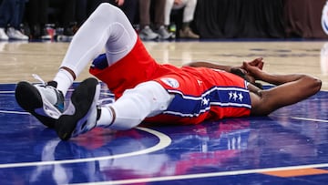 Philadelphia 76ers center Joel Embiid (21) lays on the court after getting injured in the second quarter.