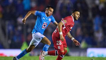 Carlos Rodriguez (L) of Cruz Azul fights for the ball with Alexis Vega (R) of Toluca during the 4th round match between Cruz Azul and Toluca as part of the Liga BBVA MX, Torneo Apertura 2024 at Ciudad de los Deportes Stadium on July 20, 2024 in Mexico City, Mexico.