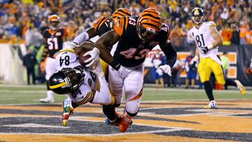 Dec 4, 2017; Cincinnati, OH, USA; Pittsburgh Steelers wide receiver Antonio Brown (84) catches the game tying touchdown against Cincinnati Bengals cornerback Dre Kirkpatrick (27) and is hit as a penalty of unnecessary roughness is called on free safety George Iloka (right) in the second half at Paul Brown Stadium. Mandatory Credit: Aaron Doster-USA TODAY Sports