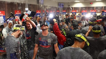 The Texas Rangers made history with their first-ever World Series title and the team celebrated with so much champagne that some players wore eye goggles.