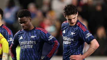 Soccer Football - Premier League - Brentford v Arsenal - GTech Community Stadium, London, Britain - February 12, 2026 Arsenal's Bukayo Saka and Declan Rice look dejected after Brentford's Keane Lewis-Potter scores their first goal Action Images via Reuters/Paul Childs EDITORIAL USE ONLY. NO USE WITH UNAUTHORIZED AUDIO, VIDEO, DATA, FIXTURE LISTS, CLUB/LEAGUE LOGOS OR 'LIVE' SERVICES. ONLINE IN-MATCH USE LIMITED TO 120 IMAGES, NO VIDEO EMULATION. NO USE IN BETTING, GAMES OR SINGLE CLUB/LEAGUE/PLAYER PUBLICATIONS. PLEASE CONTACT YOUR ACCOUNT REPRESENTATIVE FOR FURTHER DETAILS..