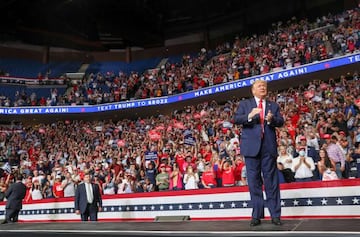 FILE PHOTO: U.S. President Donald Trump reacts to the crowd as he arrives onstage at his first re-election campaign rally in several months in the midst of the coronavirus disease (COVID-19) outbreak, at the BOK Center in Tulsa, Oklahoma, U.S., June 20, 2