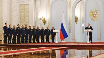 Russian President Vladimir Putin (R) delivers a speech as soldiers stand by after awarding them with the Gold Star medal during a ceremony held on the eve of the "Heroes of the Fatherland Day" at the Kremlin in Moscow on December 8, 2022. (Photo by Alexey MAISHEV / SPUTNIK / AFP) (Photo by ALEXEY MAISHEV/SPUTNIK/AFP via Getty Images)