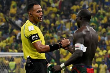 Elfath (left) shakes Aboubakar's hand.