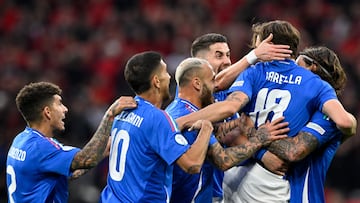 Italy's midfielder #18 Nicolo Barella celebrates with teammates after scoring his team's second goal during the UEFA Euro 2024 Group B football match between Italy and Albania at the BVB Stadion in Dortmund on June 15, 2024. (Photo by INA FASSBENDER / AFP)