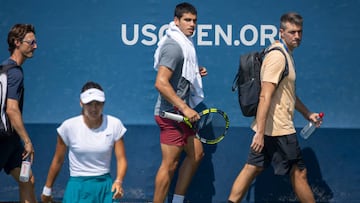 NEW YORK, USA, August 26. Carlos Alcaraz of Spain walks past Emma Raducanu of Great Britain during her practice session in preparation for the US Open Tennis Championship 2022 at the USTA National Tennis Centre on August 26th 2022 in Flushing, Queens, New York City.  (Photo by Tim Clayton/Corbis via Getty Images)