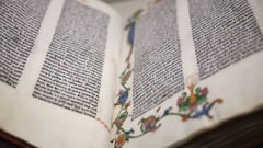 This photograph taken on April 12, 2023, shows "The Biblia Latina Gutemberg Bible", the first book printed in Europe using movable type, in 1455, displayed as part of the exhibition "Print! Gutenberg's Europe at the Bibliotheque Francois Mitterand (BnF) in Paris. (Photo by Anne-Christine POUJOULAT / AFP) (Photo by ANNE-CHRISTINE POUJOULAT/AFP via Getty Images)