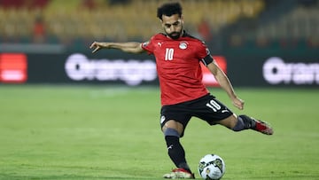 Egypt&#039;s forward Mohamed Salah shoots a ball during the Group D Africa Cup of Nations (AFCON) 2021 football match between Egypt and Sudan at Stade Ahmadou Ahidjo in Yaounde on January 19, 2022. (Photo by Kenzo Tribouillard / AFP)