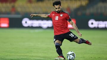 Egypt's forward Mohamed Salah shoots a ball during the Group D Africa Cup of Nations (AFCON) 2021 football match between Egypt and Sudan at Stade Ahmadou Ahidjo in Yaounde on January 19, 2022. (Photo by Kenzo Tribouillard / AFP)