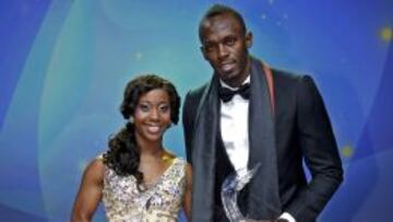 Shelly-Ann Fraser-Ryce y Usain Bolt, con sus trofeos. 