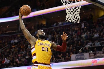 LeBron James slam dunks in Cleveland's win over the Atlanta Hawks.