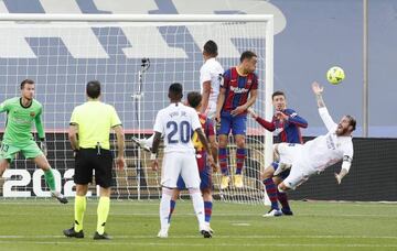 Pen given | Real Madrid's Sergio Ramos is fouled in the penalty area by Barcelona's Clement Lenglet.