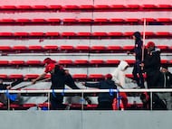 Independiente supporters attack a Universidad de Chile fan during the second leg of the Copa Sudamericana Round of 16 match, which was suspended due to violence in the stands, with the Chilean side leading on aggregate, in Avellaneda, Argentina August 20, 2025. REUTERS/Facundo Morales