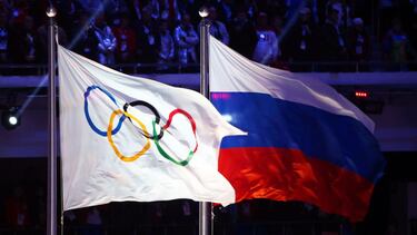 Sochi (Russian Federation).- (FILE) - The Olympic flag (L) and the Russian flag (R) fly during the closing ceremony of the Sochi 2014 Olympic Games at Fisht Olympic Stadium in Sochi, Russia, 23 February 2014 (re-issued on 17 December 2020). Russia has bee