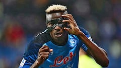 Napoli's Nigerian forward Victor Osimhen reacts after scoring his side's second goal during the Italian Serie A football match between Sassuolo and Napoli on February 17, 2023 at the Citta del tricolore stadium in Sassuolo. (Photo by Marco BERTORELLO / AFP)