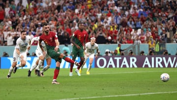 LUSAIL CITY, QATAR - NOVEMBER 28: Bruno Fernandes of Portugal scores their team's second goal off a penalty during the FIFA World Cup Qatar 2022 Group H match between Portugal and Uruguay at Lusail Stadium on November 28, 2022 in Lusail City, Qatar. (Photo by Lars Baron/Getty Images)