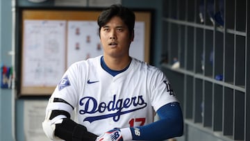 Oct 11, 2024; Los Angeles, California, USA; Los Angeles Dodgers designated hitter Shohei Ohtani (17) looks on in the dugout in the first inning against the San Diego Padres during game five of the NLDS for the 2024 MLB Playoffs at Dodger Stadium. Mandatory Credit: Kiyoshi Mio-Imagn Images