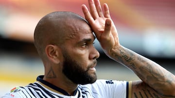 (FILES) In this file photo taken on September 03, 2022 Pumas' Brazilian defender Dani Alves gestures during the Mexican Apertura tournament football match against Atlas at the Jalisco stadium in Guadalajara, Jalisco State, Mexico. - Mexico's Pumas announced on January 20, 2023 that they had terminated Dani Alves' contract after the veteran Brazil defender was arrested and remanded in custody in Spain on allegations of sexual assault. (Photo by Ulises Ruiz / AFP)