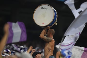 A Real Madrid fan plays with a drum during the UEFA Champions League football match Real Madrid CF vs APOEL