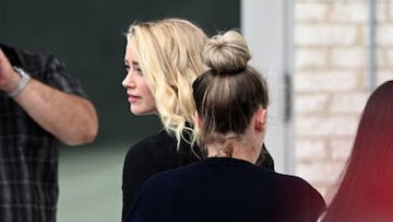 US actress Amber heard and her sister Whitney Heard (R) arrive at the Fairfax County Circuit Courthouse in Fairfax, Virginia, on June 1, 2022. - The jury reached a verdict on Wednesday in the high-profile defamation case between actor Johnny Depp and his ex-wife Heard. The seven-person Virginia jury has been deliberating for about 13 hours over three days in Fairfax County Circuit Court near the US capital. The court said the verdict is to be read out at 3:00 pm (1900 GMT). (Photo by Brendan SMIALOWSKI / AFP) (Photo by BRENDAN SMIALOWSKI/AFP via Getty Images)