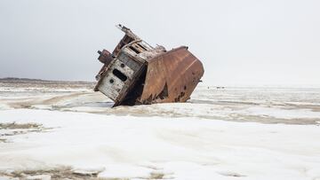 cul 22 f01  TASTUBEK, KAZAKHSTAN - 2018/02/26: A fishing ship sits abandoned on the surface of the dried up Aral Sea in Kazakhstan. The Aral Sea, once the fourth-largest lake in the world, started drying out and shrinking due to disastrous Soviet irrigation policies, but a dam has brought water - and fish species- back to the northern section. (Photo by Taylor Weidman/LightRocket via Getty Images)