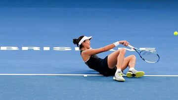 Garbine Muguruza of Spain falls down on the court in pain before retiring from her second round match against Aleksandra Krunic of Serbia at the Brisbane International tennis tournament at the Pat Rafter Arena in Brisbane on January 2, 2018.
Muguruza suf