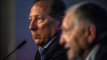 (FILES) US businessman John Textor looks on during a joint a press conference with French President of the Olympique Lyonnais (OL) football club to announce the sale of the club on June 21, 2022 in Decines-Charpieu, central-eastern France. - Olympique Lyonnais French president Jean-Michel Aulas announced he is stepping down from his position, on May 8, 2023, and will be replaced by John Textor. (Photo by OLIVIER CHASSIGNOLE / AFP)