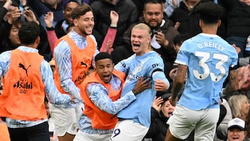 Manchester City's Norwegian striker #09 Erling Haaland (C) celebrates scoring their second goal during the English Premier League football match between Manchester City and Manchester United at the Etihad Stadium in Manchester, north west England, on September 14, 2025. (Photo by Oli SCARFF / AFP) / RESTRICTED TO EDITORIAL USE. No use with unauthorized audio, video, data, fixture lists, club/league logos or 'live' services. Online in-match use limited to 120 images. An additional 40 images may be used in extra time. No video emulation. Social media in-match use limited to 120 images. An additional 40 images may be used in extra time. No use in betting publications, games or single club/league/player publications. /