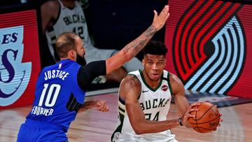 Aug 29, 2020; Lake Buena Vista, Florida, USA; Milwaukee Bucks forward Giannis Antetokounmpo (34) drives to the basket against Orlando Magic guard Evan Fournier (10) during the fourth quarter in game five of the first round of the 2020 NBA Playoffs at AdventHealth Arena. Mandatory Credit: Kim Klement-USA TODAY Sports