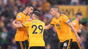 WOLVERHAMPTON, ENGLAND - AUGUST 11: Raul Jimenez of Wolverhampton Wanderers celebrates with teammates Ruben Vinagre and Conor Coady after scoring his team's second goal during the Premier League match between Wolverhampton Wanderers and Everton FC a