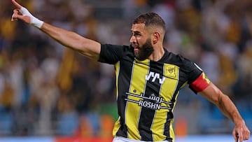 Ittihad's French forward #09 Karim Benzema reacts after scoring his team's first goal during the Saudi Pro League football match between Al-Ittihad and Al-Riyadh at the Prince Faisal Bin Fahd stadium in Riyadh on August 24, 2023. (Photo by Fayez NURELDINE / AFP)