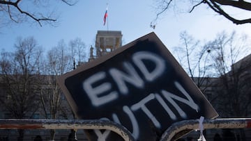 "End Putin" is seen written on a sign during a protest against the war in Ukraine, in front of the Russian Embassy