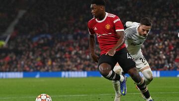 Manchester United's English defender Teden Mengi (L) controls the ball during the UEFA Champions League Group F football match between Manchester United and Young Boys at Old Trafford stadium in Manchester, north west England on December 8, 2021. (Ph