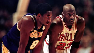 Los Angeles Lakers guard Kobe Bryant(L) and Chicago Bulls guard Michael Jordan talk during a free-throw attempt in the fourth quarter 17 December at the United Center in Chicago. Bryant, who is 19 and bypassed college basketball to play in the NBA, scored a team-high 33 points off the bench, and Jordan scored a team-high 36 points. The Bulls defeated the Lakers 104-83.  