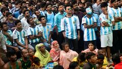 Football fans watch the Qatar 2022 World Cup Group C football match between Argentina and Saudi Arabia on a big screen at Dhaka University area in Dhaka, Bangladesh on November 22, 2022. (Photo by Syed Mahamudur Rahman/NurPhoto via Getty Images)