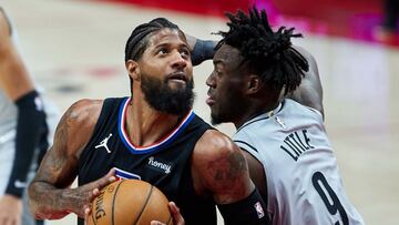 Apr 20, 2021; Portland, Oregon, USA; LA Clippers guard Paul George (13) spins around Portland Trail Blazers forward Nassir Little (9) during the first quarter at the Moda Center. Mandatory Credit: Craig Mitchelldyer-USA TODAY Sports