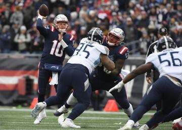 Nov 28, 2021; Foxborough, Massachusetts, USA; New England Patriots quarterback Mac Jones (10) throws a pass during the first half against the Tennessee Titans at Gillette Stadium. Mandatory Credit: Bob DeChiara-USA TODAY Sports