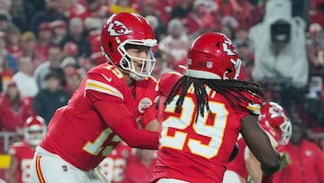 Nov 4, 2024; Kansas City, Missouri, USA; Kansas City Chiefs quarterback Patrick Mahomes (15) hands off to running back Kareem Hunt (29) during the first half at GEHA Field at Arrowhead Stadium. Mandatory Credit: Denny Medley-Imagn Images
