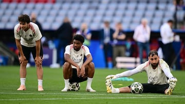 (LtoR) Paris Saint-Germain's Portuguese midfielder #87 Joao Neves, Paris Saint-Germain's French forward #49 Ibrahim Mbaye, and Paris Saint-Germain's Italian goalkeeper #01 Gianluigi Donnarumma attend the MD-1 training session on the eve of the UEFA Champions League final football match between Inter Milan and Paris Saint-Germain (PSG) in Munich, southern Germany, on May 30, 2025. (Photo by Marco BERTORELLO / AFP)