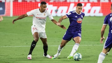 Fernando Reges, of Sevilla Futbol Club, Hatem Ben Arfa, of Real Valladolid,during the spanish league, LaLiga, football match played between Sevilla Futbol Club and Real Valladolid at Ramon Sanchez Pizjuan Stadium on June 26, 2020 in Sevilla, Spain.
 
 
 2