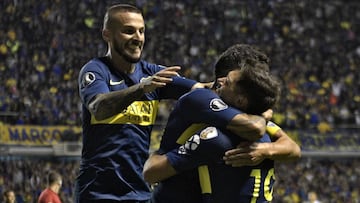 Argentina&#039;s Boca Juniors forward Mauro Zarate (R) celebrates with teammates forward Carlos Tevez (C) and forward Dario Benedetto after scoring the team&#039;s third goal against Colombia&#039;s Deportes Tolima during a Copa Libertadores 2019 group G football match at the &quot;Bombonera&quot; stadium in Buenos Aires, Argentina, on March 12, 2019. (Photo by JUAN MABROMATA / AFP)