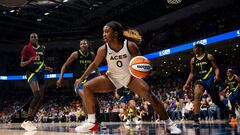 Sep 29, 2023; Arlington, Texas, USA; Las Vegas Aces guard Jackie Young (0) controls the ball as Dallas Wings center Kalani Brown (21) and forward Natasha Howard (6) look on during the second half during game three of the 2023 WNBA Playoffs at College Park Center. Mandatory Credit: Jerome Miron-USA TODAY Sports
