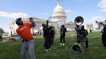 Mekhi Thomas with United We Dream Action dances to a band as several immigrant rights groups gather to push for immigration and pathway to citizenship reform in the reconciliation bill.