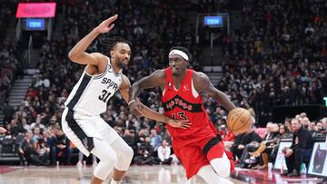 Feb 8, 2023; Toronto, Ontario, CAN; Toronto Raptors forward Pascal Siakam (43) controls the ball as San Antonio Spurs forward Keita Bates-Diop (31) defends during the third quarter at Scotiabank Arena. Mandatory Credit: Nick Turchiaro-USA TODAY Sports