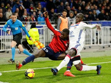 Lille's Nicolás Pépé in action with Lyon's Ferland Mendy.