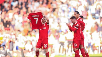LIVERPOOL, ENGLAND - OCTOBER 29: Diogo Jota of Liverpool holds the shirt of teammate Luis Diaz after scoring their first goal to make the score 1-0 during the Premier League match between Liverpool FC and Nottingham Forest at Anfield on October 29, 2023 in Liverpool, England. (Photo by Daniel Chesterton/Offside/Offside via Getty Images)