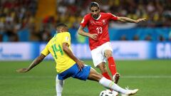 ROSTOV-ON-DON, RUSSIA - JUNE 17:  Danilo of Brazil tackles Ricardo Rodriguez of Switzerland during the 2018 FIFA World Cup Russia group E match between Brazil and Switzerland at Rostov Arena on June 17, 2018 in Rostov-on-Don, Russia.  (Photo by Buda Mende